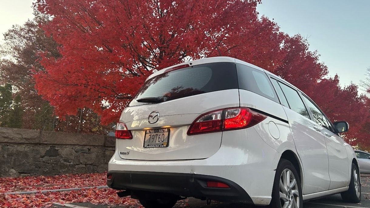 White Wellness Wagon vehicle from behind